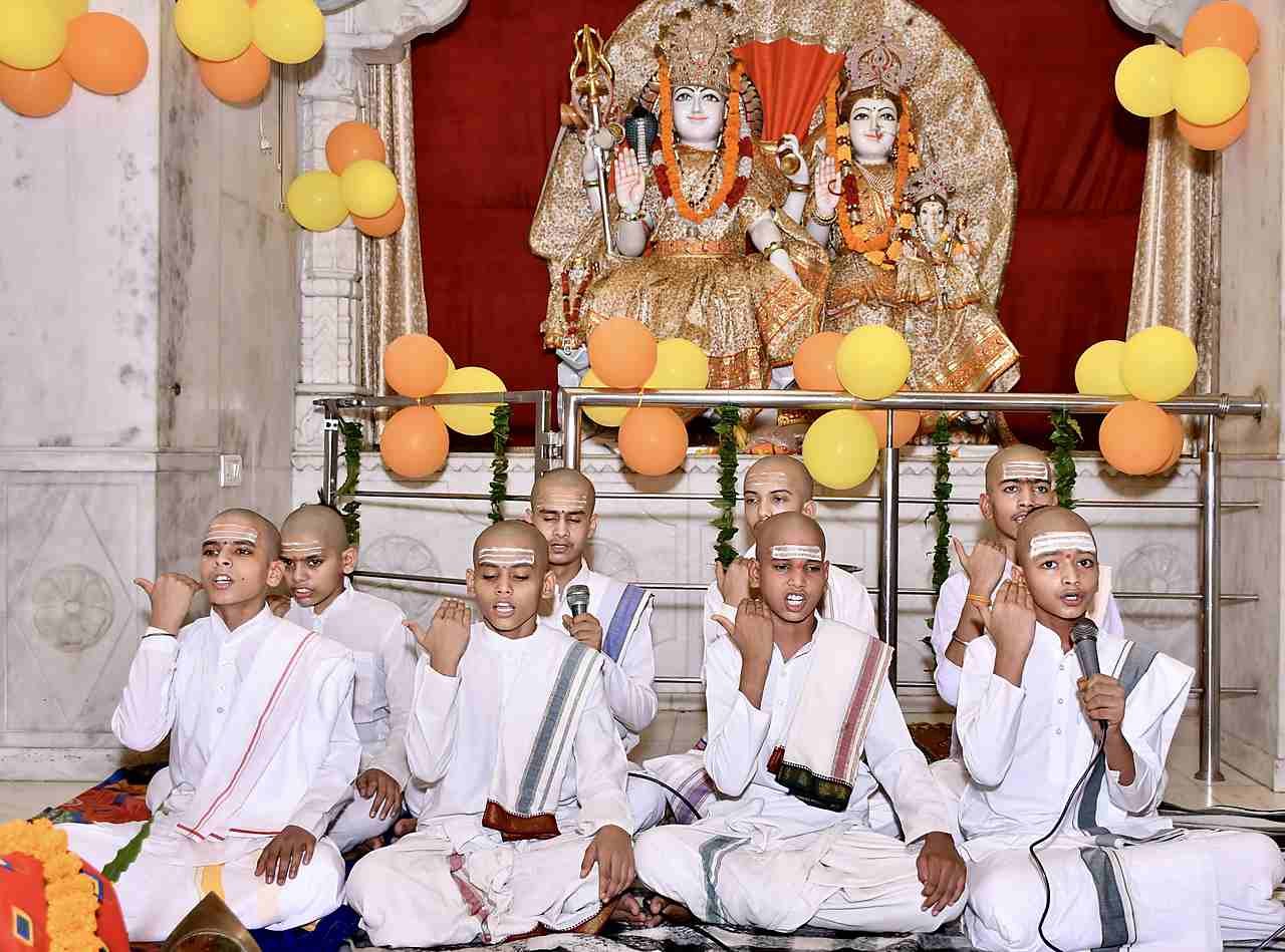 Gurukul students singing before the deities